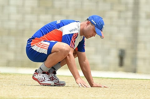 Jonathan Trott checks the pitch during a training session. (Photo | AFP)