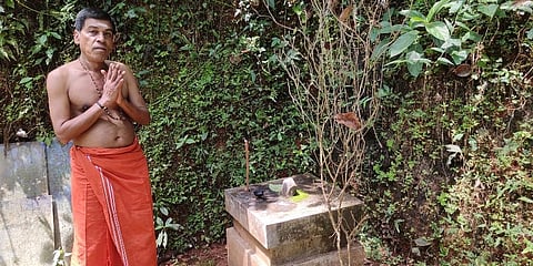 Chandran Panikker near the 'Gulikan Thara' at his house at Naduvathur in Kozhikode | EPS