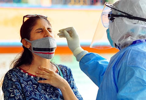 Health workers collecting Samples of Covid-19. (Photo | G Satyanarayana, EPS)
