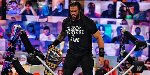 Roman Reigns celebrates after winning the WWE Universal Championship. (Photo| Twitter/ @WWERomanReigns)