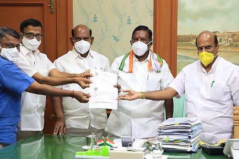 Temple administrators with the lease agreement for the maintenance of the elephant, along with CM V  Narayanasamy, Speaker V P Sivakozhunthu and other officials on Monday
