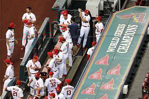 In this July 24, 2020, file photo, members of the St. Louis Cardinals wait to be introduced before the start of a baseball game against the Pittsburgh Pirates. (Photo | AP)