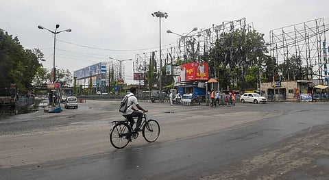 commuter rides a bicycle on a deserted city road during weekly two-day complete lockdown to curb the spread of coronavirus disease in Kolkata Thursday July 23 2020. (Photo | PTI)