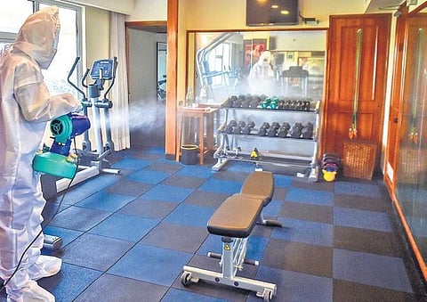 A worker sanitises a gym in Kolkata (File Photo | PTI)