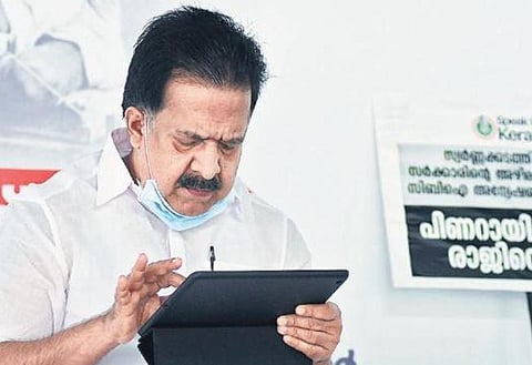 Opposition leader Ramesh Chennithala reading messages on his tablet during UDF’s #SpeakUpKerala campaign on Monday at his official residence in Thiruvananthapuram | Vincent Pulickal