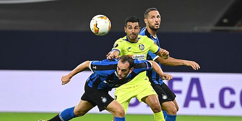 Inter Milan's Diego Godin challenges for the ball with Getafe's Angel during an Europa League rmatch at the Veltins-Arena in Gelsenkirchen. (Photo| AFP)