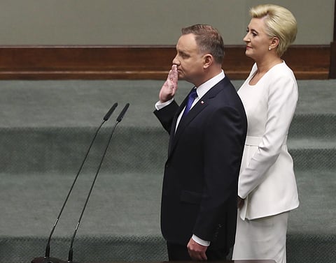 Poland's conservative President Andrzej Duda,left, being sworn in for his second five-year term by lawmakers at the parliament in Warsaw, Poland. (Photo | AP)