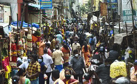 Social distance going for a toss at Badrinarayanan street flower bazzar market at Broadway. (Photo | EPS/Ashwin Prasath)
