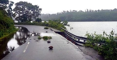 Following heavy rain in Valparai hill station, a portion of the road leading to Sholayar dam got damaged on Friday. (Photo| EPS/special arrangement)