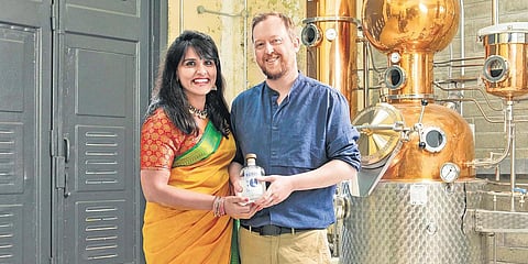 Bhagya Lekshmi and Robert Barrett with a bottle of Maharani Gin. (Photo| Special Arrangement)