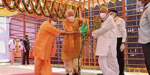 PM Narendra Modi and Uttar Pradesh CM Yogi Adityanath planting parijaat sapling during the 'Ram Mandir' bhoomi pujan. (Photo| Special Arrangement)