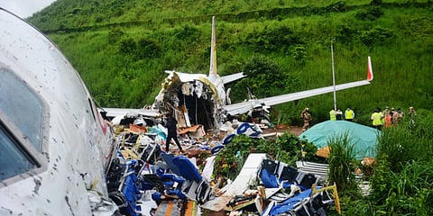 The crashed Air India Express flight at the Karipur International Airport. (Photo| Manu R Mavelil, EPS)