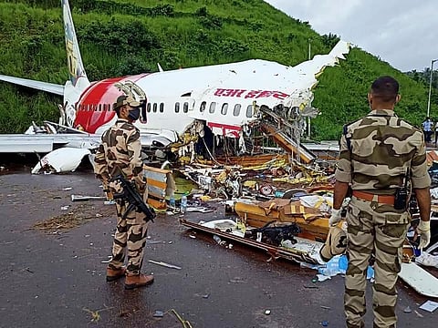 Army personnel stand guard at the site of the wreckage of Air India Express flight at Kozhikode International Airport in Karipur. (File photo| ANI)