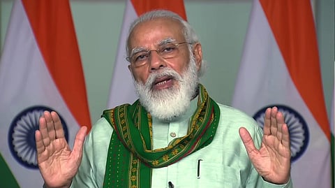 Prime Minister Narendra Modi speaks during a launches financing facility under Agriculture Infrastructure Fund and releases benefits under the PM-KISAN scheme, in New Delhi on Sunday. (Photo | ANI)