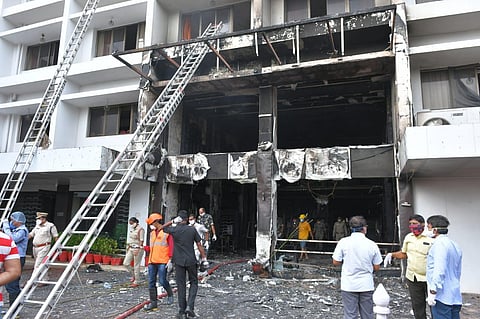 Fire broke out at Swarna Palace where a private hospital took it for treating covid patients in Vijayawada on Sunday. (Photo | Prasant Madugula, EPS)