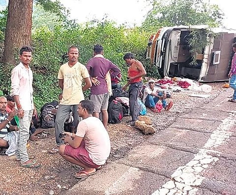 ​​Injured migrant workers take rest near the ill-fated bus on Thursday | Express