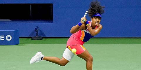 Naomi Osaka returns a shot to Jennifer Brady during a semifinal match of the US Open. (Photo | AP)