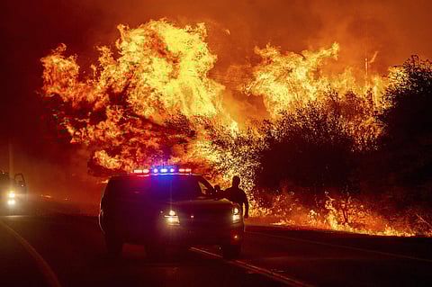 Deadly wildfires in heavily populated northwest Oregon were growing, with hundreds of thousands of people told to flee encroaching flames while residents to the south tearfully assessed their losses. (Photo | AP)