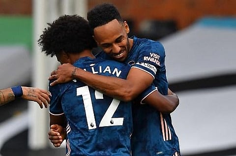 Arsenal's Gabonese striker Pierre-Emerick Aubameyang (R) celebrates scoring their third goal with Arsenal's Brazilian midfielder Willian (L) during the English Premier League match. (Photo | AFP)