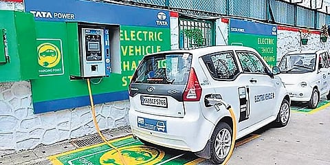 An electric vehicle getting charged at a charging station in Delhi (Photo | EPS)