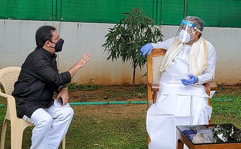 Chamarajpet MLA Zameer Ahmed Khan meets Congress Legislature Party Chief Siddaramaiah at his residence in Bengaluru on Friday | express