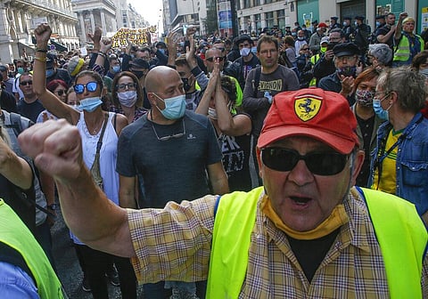 A man wearing a yellow west march in Paris, Saturday, Sept. 12, 2020, to denounce social injustice. (Photo | AP)