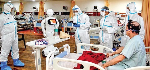 A patient interacts with family via a robot at Yatharth Hospital in Noida. (Photo | PTI)
