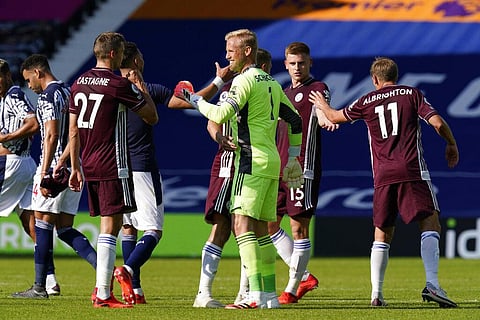 Leicester's goalkeeper Kasper Schmeichel, center, congratulates with teammates at the end of the English Premier League soccer match between West Bromwich and Leicester City. (Photo | AP)