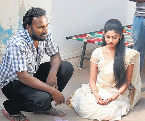 Phathmen with Oviya on the sets of Madha Yaanai Kootam