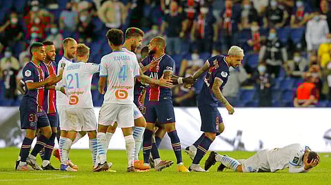 PSG and Marseille players clash near the end of the French League One soccer match between Paris Saint-Germain and Marseille at the Parc des Princes in Paris. (Photo | AP)