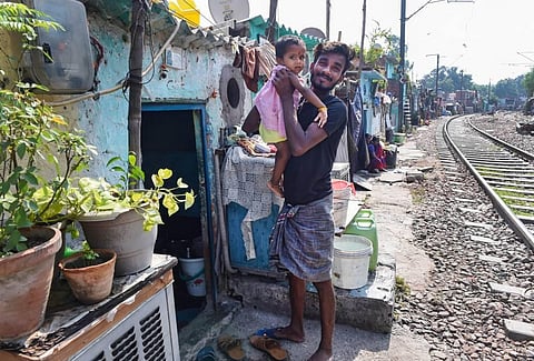 Resident of a slum near Lajpat Nagar Railway line in New Delhi Saturday Sept. 12 2020. (Photo | PTI)