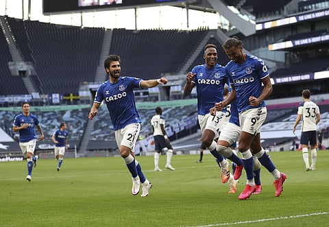 Everton's Dominic Calvert-Lewin, right, celebrates after scoring his side's opening goal during the English Premier League soccer match between Tottenham Hotspur and Everton. (Photo | AP)