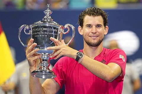 Dominic Thiem, of Austria, holds up the championship trophy after defeating Alexander Zverev, of Germany, in the men's singles final of the US Open tennis championships. (Photo | AP)