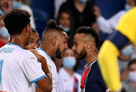 Paris Saint-Germain's Brazilian forward Neymar (R) argues with Marseille's French midfielder Dimitri Payet (C) during the French L1 football match. (Photo | AFP)