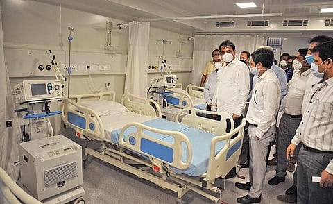 Deputy CM Dr Ashwath Narayan inspects the 50-bed modular container ICU at KC General Hospital in Malleswaram, Bengaluru, on Wednesday | express