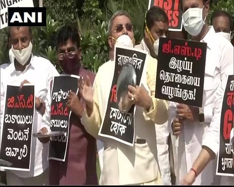 Opposition leaders protest in the Parliament Complex demanding GST dues.