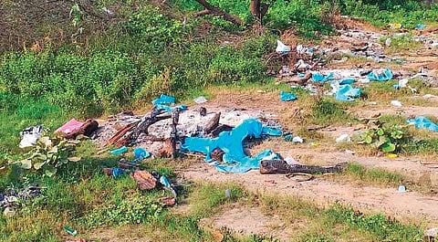 PPE suits, gloves and facemasks strewn on the banks of Brahmani at Vedvyas
