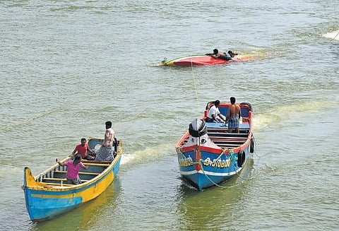 Boats set out for fishing from the estuary at Muthalapozhi  fishing harbour in Thiruvananthapuram ,B P Deepu