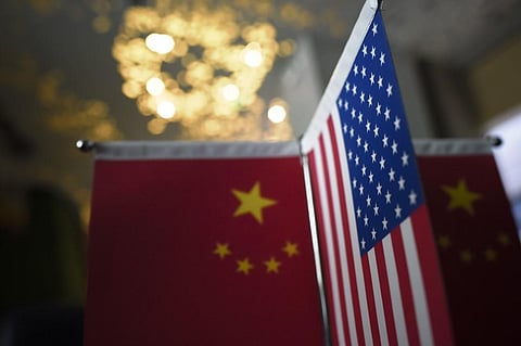 Chinese flags and American flags. (Photo | AFP)
