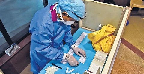 A health worker collects samples at Civic Centre in New Delhi (Photo | Parveen Negi, EPS)