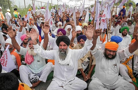 Farmers block the Amritsar-Delhi national highway during a protest against the central government in Amritsar. (Photo | PTI)