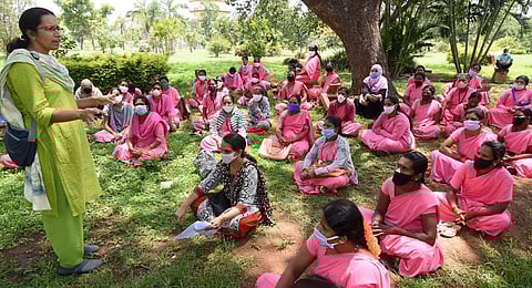 ASHA workers stage a protest . (Photo | Udayshankar S, EPS)