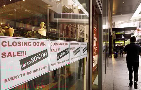 Signs in store window advertise that they are closing in Sydney, Wednesday, Sept. 2, 2020. (Photo | AP)