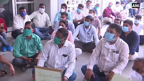Lab technicians protest outside BRD Medical College Principal's office demanding action against junior doctors. (Photo | ANI)