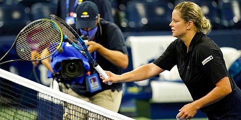 Kim Clijsters of Belgium taps racquets with Ekaterina Alexandrova of Russia after loosing her match during the first round of the US Open. (Photo | AP)