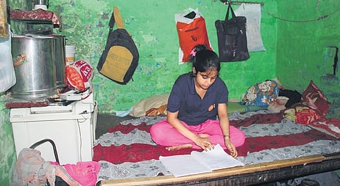 Priya at her home in Chanderpuri slum; (right)at Asha Centre’s library