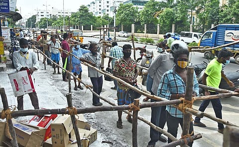 People seen queueing up, whilst following social distancing norms, at a Tasmac outlet on Wallajah Road in Chennai. (Photo | Ashwin Prasath, EPS)