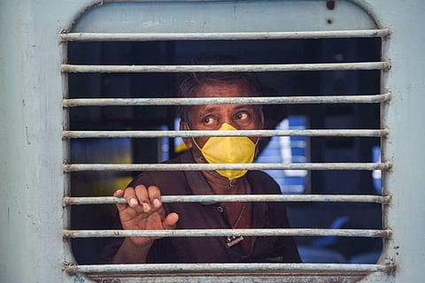 A migrant worker returning to his native on a Shramik Special train. (Photo | PTI)
