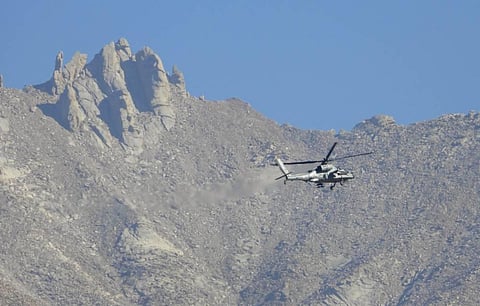 An IAF chopper flies over Ladakh region amid border tension with China in Leh Saturday Sept. 19 2020. (Photo | PTI)