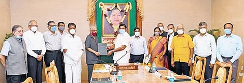 Chief Minister Edappadi K Palaniswami receiving the report on economic revival from the committee headed by former RBI Governor C Rangarajan on Monday